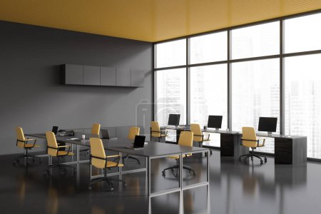 Photo for Corner view on dark office room interior with computers, desks, armchairs, panoramic window with skyscraper view, concrete floor. Concept of company, firm, meeting space. 3d rendering - Royalty Free Image