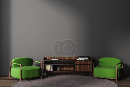 Téléchargez les photos : Grey relaxing interior with green soft armchairs and wooden sideboard, carpet on hardwood floor. Chill zone with mock up empty grey wall. 3D rendering - en image libre de droit