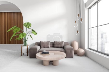 Foto de White living room interior with sofa, coffee table on light concrete floor. Plant and art decoration in the corner, panoramic window on city view. Mockup empty wall. 3D rendering - Imagen libre de derechos