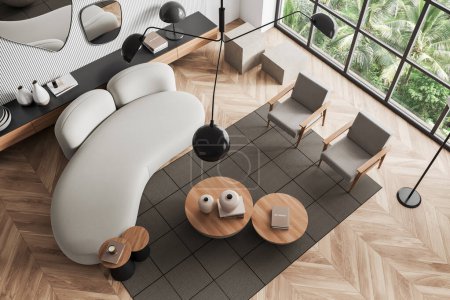 Téléchargez les photos : Top view of living room interior with sofa and two armchairs, coffee table and dresser with decoration, hardwood floor. Panoramic window on tropics. 3D rendering - en image libre de droit