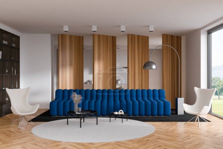 Téléchargez les photos : Modern studio interior with sofa and armchairs, panoramic window on countryside. Kitchen with appliances and living room with shelf and decoration, hardwood floor. 3D rendering - en image libre de droit