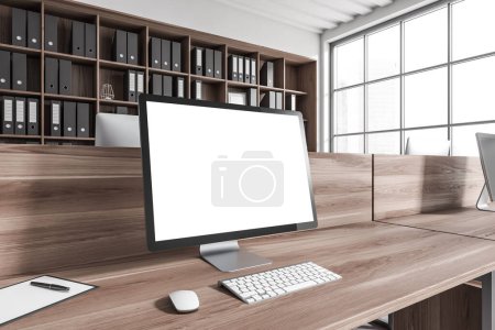 Foto de Modern workplace interior with pc computer, side view, wooden desk and shelf with documents. Panoramic window on city view. Mockup blank screen. 3D rendering - Imagen libre de derechos