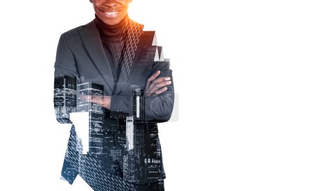 Photo for African businessman in black suit, smiling, arms crossed. Double exposure with office buildings in New York, cityscape at night. Concept of career in company. Copy space - Royalty Free Image
