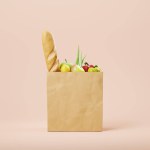 Grocery bag with food, paper bag with vegetarian products on beige background. Concept of delivery and eco. 3D rendering