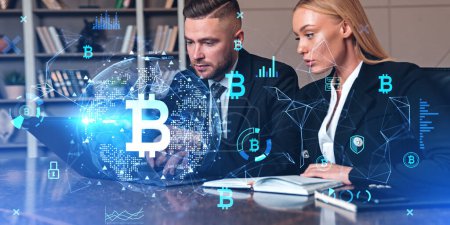 Photo for Businessman and businesswoman working with computer. Double exposure bitcoin and blockchain hologram. Concept of internet banking and financial communication - Royalty Free Image