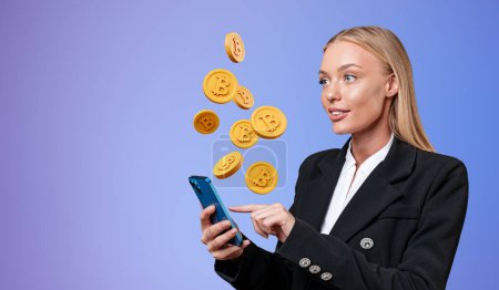 Foto de Businesswoman finger touch smartphone, falling gold bitcoins on gradient background. Concept of cryptocurrency, blockchain and internet banking - Imagen libre de derechos