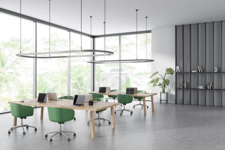 Photo for White office interior with coworking corner with armchairs and laptop, side view grey concrete floor. Shelf with decoration. Panoramic window on tropics. 3D rendering - Royalty Free Image
