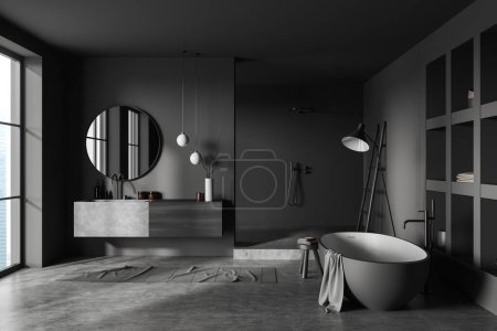 Téléchargez les photos : Dark bathroom interior with bathtub and sink with shower, towel rail ladder on grey concrete floor. Panoramic window on countryside. 3D rendering - en image libre de droit