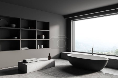 Photo for Dark bathroom interior with bathtub on grey concrete floor, side view. Shelf and podium with decoration and accessories, panoramic window on countryside. 3D rendering - Royalty Free Image