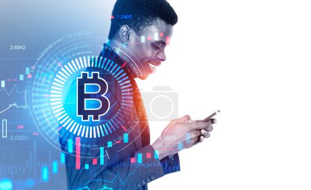 Photo for African businessman smiling profile working with phone. Cryptocurrency hologram with bitcoin icon and binary, bar chart with lines. Concept of financial communication. Copy space - Royalty Free Image