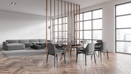 Foto de Interior de comedor moderno con paredes blancas, suelo de madera, mesa de cristal con sillas y sala de estar con sofá gris en el fondo. Ventanas con paisaje urbano borroso. renderizado 3d - Imagen libre de derechos