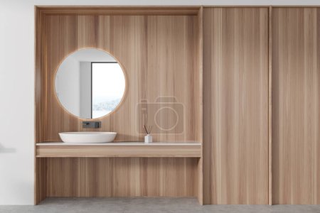 Foto de Moderno baño interior del hotel con lavabo y espejo redondo. Lavabo minimalista y espacio de copia pared de madera vacía. Renderizado 3D - Imagen libre de derechos