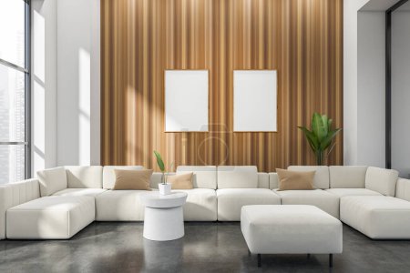 Photo for Living room interior with white sofa and pouf on grey concrete floor. Panoramic window on Singapore city view. Two mockup posters on wooden wall. 3D rendering - Royalty Free Image