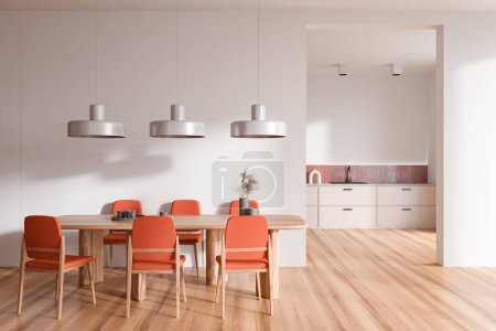 Foto de Interior de la cocina blanca con sillas naranjas y mesa de comedor, suelo de madera. Zona de cocción con electrodomésticos de fondo. Renderizado 3D - Imagen libre de derechos
