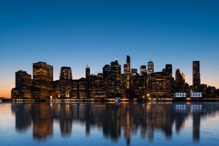 Photo for Magnificent night New York city and its reflection in the Hudson river. New York, the United States of America. Concept of sightseeing and tourism - Royalty Free Image