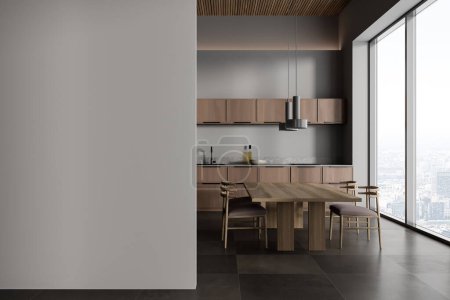 Photo for Interior of modern kitchen with gray walls, tiled floor, wooden cupboards and dining table with chairs. Panoramic window with blurry cityscape. Mock up wall to the left. 3d rendering - Royalty Free Image