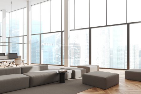 Photo for White business interior with sofa and pouf, side view. Coworking corner with pc computer on background, relaxing area near panoramic window on skyscrapers. 3D rendering - Royalty Free Image