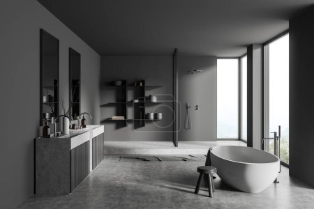 Téléchargez les photos : Dark open space salle de bain intérieure avec baignoire et double lavabo, douche et étagère avec décoration, sol en béton gris. Fenêtre panoramique sur campagne. rendu 3D - en image libre de droit