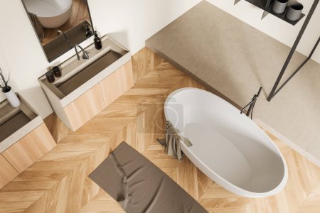 Téléchargez les photos : Vue de dessus de l'intérieur de la salle de bain avec baignoire sur plancher de bois franc. Coin lavage hôtel avec lavabo et miroir, étagère avec décoration. rendu 3D - en image libre de droit