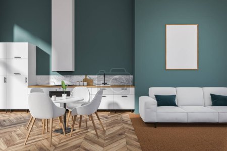 Foto de Interior de la cocina azul con zona de estar, sofá y mesa de comedor con sillas. Moderno espacio de cocina con electrodomésticos en suelo de madera. Cartel burlón, representación 3D - Imagen libre de derechos