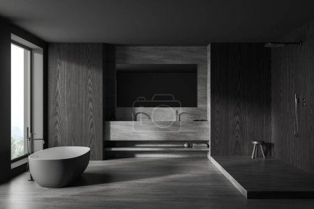 Téléchargez les photos : Intérieur de la salle de bain élégante avec des murs en bois gris et sombre, baignoire confortable debout près de la fenêtre, double lavabo avec grand miroir et douche à l'italienne. Rendu 3d - en image libre de droit