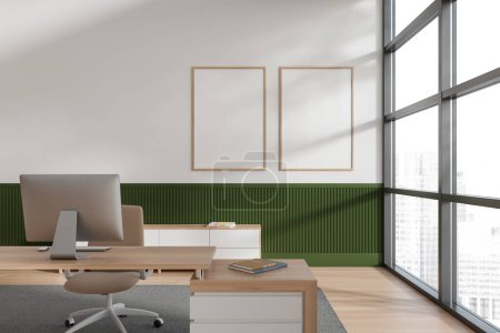 Foto de Interior de la oficina de CEO moderna con paredes blancas y verdes, suelo de madera, mesa de computadora blanca y dos carteles verticales simulados. Ventana con paisaje urbano borroso. renderizado 3d - Imagen libre de derechos