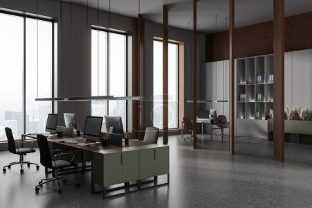 Photo for Modern coworking interior with armchairs and pc computer on desk in row, side view shelf with folders and long wooden partition. Panoramic window on skyscrapers. 3D rendering - Royalty Free Image