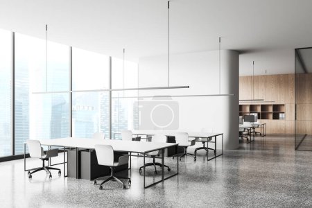 Photo for Stylish office interior with shared table and chairs, side view coworking zone behind partition. Workplace corner with panoramic window on skyscrapers. 3D rendering - Royalty Free Image