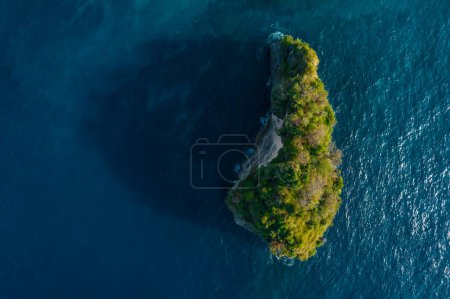 Photo for Aerial drone top view shot of rocky beach with cliff. Indian ocean shore. Copy space for text. Nature and travel background. Beautiful natural summer vacation travel concept. Waves splash. - Royalty Free Image