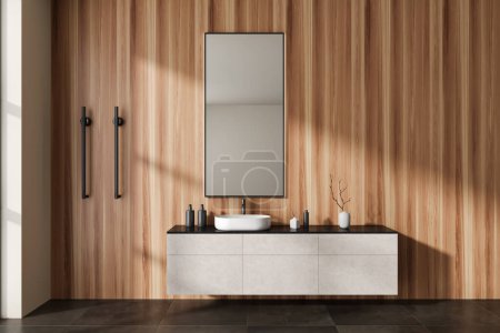 Foto de Interior de baño de madera con lavabo y armario con accesorios, riel de toalla vertical climatizada y suelo de hormigón de baldosas marrones. Acogedora sala de baño de diseño en el hogar moderno. Renderizado 3D - Imagen libre de derechos