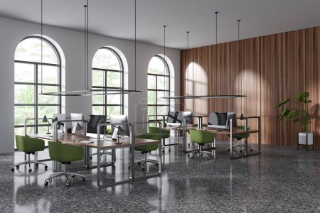 Photo for Modern office interior with armchairs and pc computer on table in row, side view grey concrete floor. Coworking open space with arched panoramic window on tropics. 3D rendering - Royalty Free Image