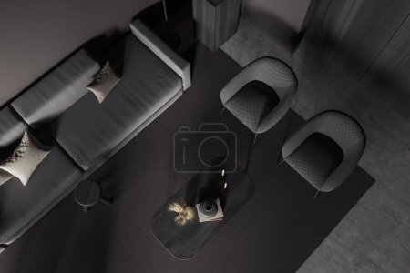 Téléchargez les photos : Vue de dessus de sombre coin détente intérieur avec canapé et deux fauteuils, table basse avec décoration, tapis sur sol en béton gris. rendu 3D - en image libre de droit