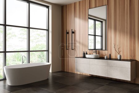 Photo for Wooden hotel bathroom interior with bathtub and sink, side view cabinet with minimalist accessories, beige concrete tile floor. Panoramic window on tropics. 3D rendering - Royalty Free Image