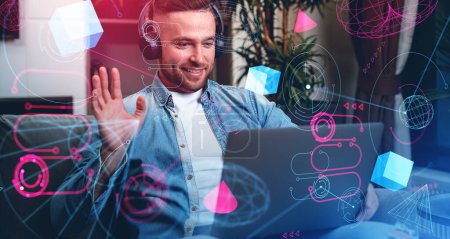 Photo for Happy businessman in headphones, waving hand looking at laptop, double exposure with metaverse icons and dashboard, blockchain and information fields. Concept of virtual meeting - Royalty Free Image