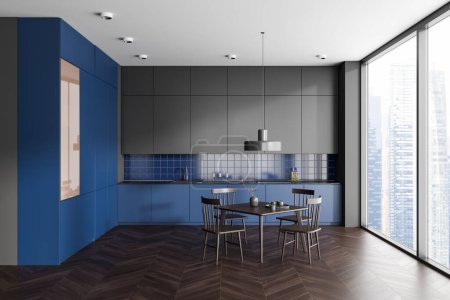 Foto de Interior de la cocina moderna con paredes azules y grises, suelo de madera oscura, armarios azules con fregadero incorporado y cocina y mesa de comedor cuadrada con sillas. renderizado 3d - Imagen libre de derechos