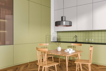 Foto de Interior de la cocina verde con mesa de madera y asientos, vista lateral piso de madera. Cocina moderna y comedor esquina en el apartamento en casa. Renderizado 3D - Imagen libre de derechos