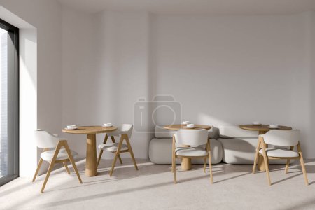Téléchargez les photos : Intérieur du restaurant minimaliste avec murs blancs, sol en pierre, tables rondes avec chaises blanches et canapé confortable. Rendu 3d - en image libre de droit