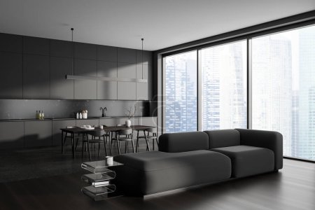 Photo for Dark home studio interior with sofa and dinner table with chairs, side view. Cooking and relaxing corner with panoramic window on Singapore skyscrapers. 3D rendering - Royalty Free Image