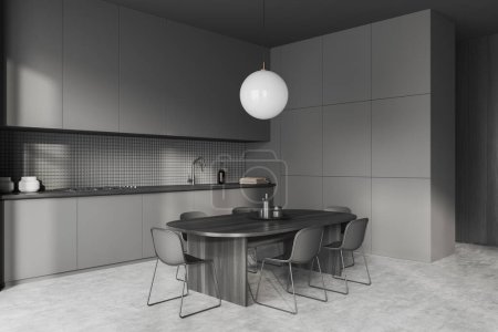Foto de Interior de la cocina oscura con mesa de comedor y sillas, vista lateral, suelo de hormigón gris. Utensilios de cocina y armarios ocultos, estantes ocultos minimalistas. Renderizado 3D - Imagen libre de derechos