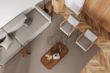 Téléchargez les photos : Vue de dessus de la lumière salon intérieur avec canapé et deux fauteuils, table basse avec décoration, tapis sur plancher de bois franc. rendu 3D - en image libre de droit