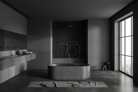 Téléchargez les photos : Dark home salle de bain intérieure avec double lavabo, baignoire et douche, serviette de pieds sur sol en béton gris. Espace ouvert salle de séjour. Fenêtre panoramique sur campagne. rendu 3D - en image libre de droit