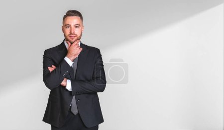 Photo for Portrait of pensive young bearded businessman in elegant suit over white background. Concept of planning and decision making. Mock up - Royalty Free Image