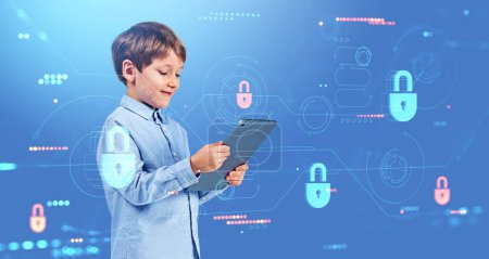 Photo for Happy boy play video games with tablet in hands. Lock hud hologram and dashboard with data security protection and statistics. Concept of safe internet for kids and parental control - Royalty Free Image