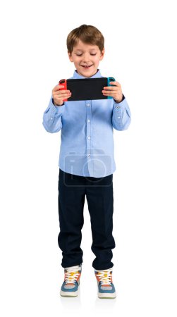 Photo for Happy boy with console in hands, playing video games full length, isolated over white background. Concept of online entertainment and fun - Royalty Free Image