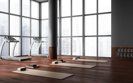 Foto de Esquina de elegante gimnasio con paredes grises, suelo de madera oscura, cintas de correr y colchonetas de yoga beige. Concepto de deporte y estilo de vida activo. renderizado 3d - Imagen libre de derechos