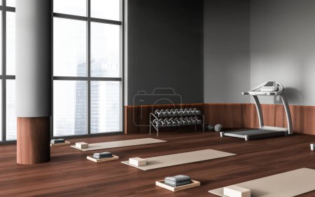 Photo for Grey gym room interior with treadmill and yoga mat in row on hardwood floor, side view. Dumbbell storage rack near panoramic window on Singapore skyscrapers. 3D rendering - Royalty Free Image