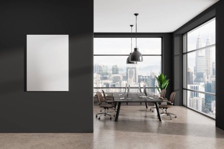 Photo for Dark coworking interior with armchairs, desk with pc computer in row. Panoramic window on Kuala Lumpur skyscrapers. Mock up canvas poster on partition. 3D rendering - Royalty Free Image