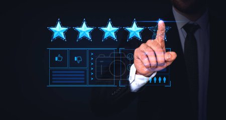 Photo for Hand of unrecognizable businessman giving four star rating over dark blue background. Concept of giving service feedback and ranking - Royalty Free Image