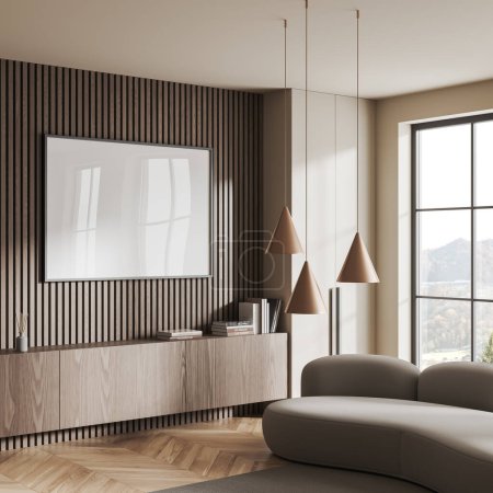 Foto de Interior de la sala de estar beige con sofá y aparador con decoración de arte, alfombra vista lateral en suelo de madera. Cartel de ventana panorámica y lienzo maqueta. Renderizado 3D - Imagen libre de derechos