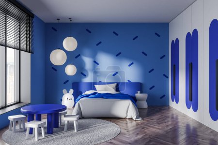 Foto de Interior del elegante dormitorio infantil con paredes azules, suelo de madera, cómoda cama azul y mesa redonda con sillas. renderizado 3d - Imagen libre de derechos